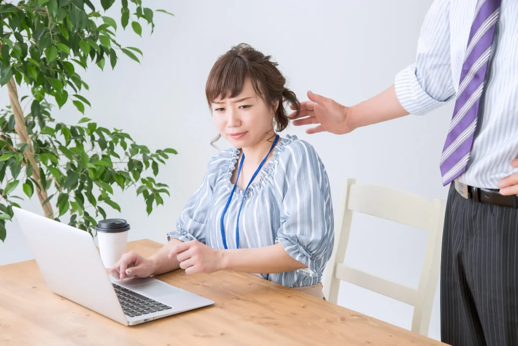 A woan experiencing sexual harassment at work. If you are being sexually harassed, we recommend contacting a skilled sexual harassment attorney.