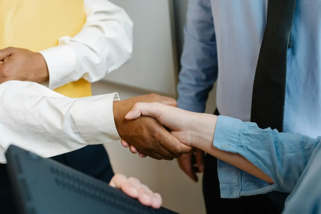 Two people shaking hands.